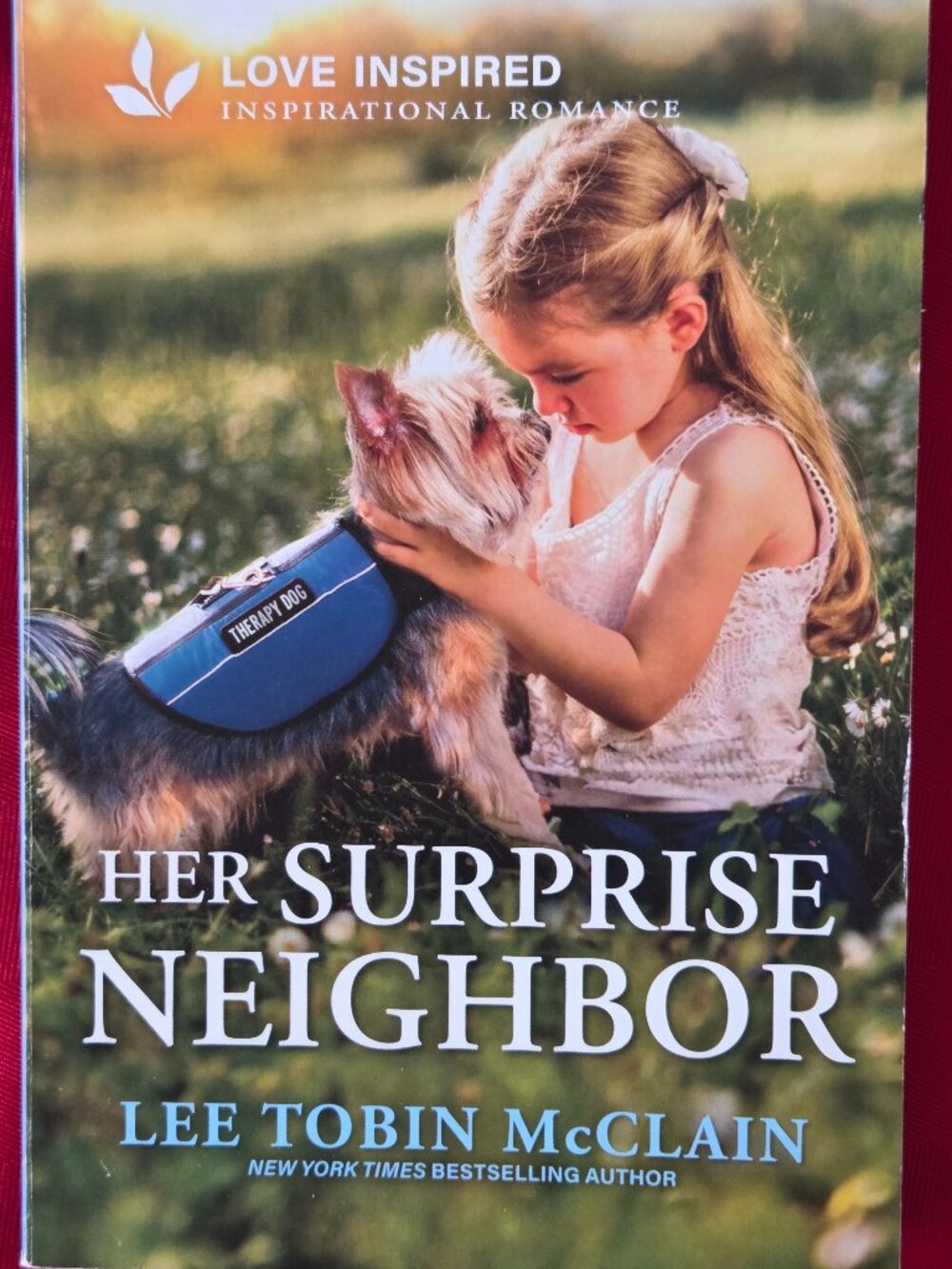 2025, HER SURPRISE NEIGHBOR BY LEE TOBIN MCCLAIN, FIRST EDITION!!!